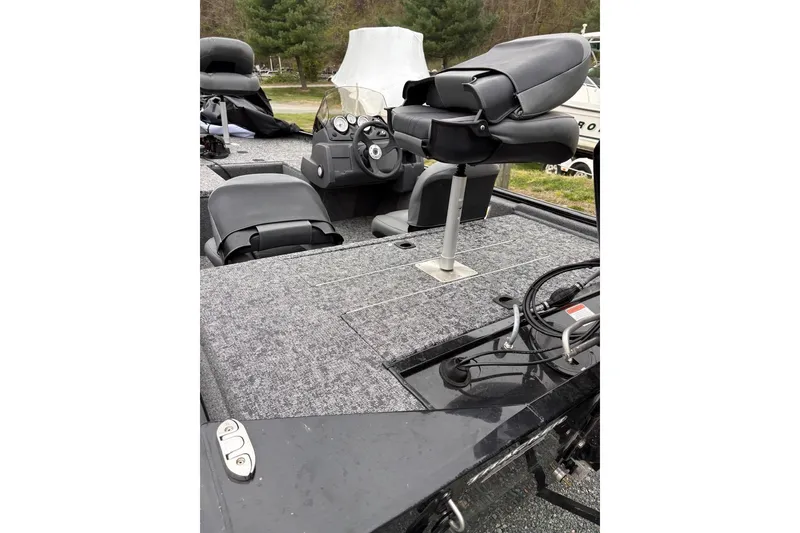 Slide: The Image of 2025 Tracker Pro 170 boat interior with seating and steering console. - 9