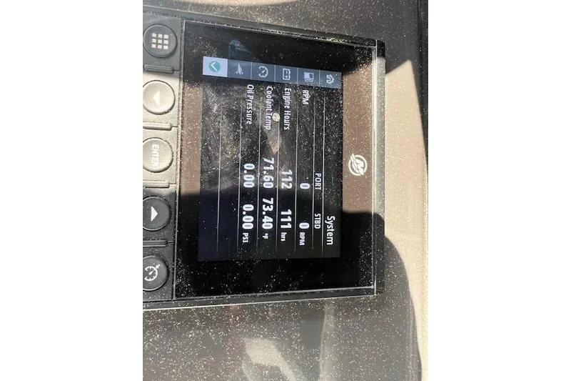 Slide: The Image of Display screen of a 2022 Blackfin 332 CC boat showing engine data and metrics. - 2