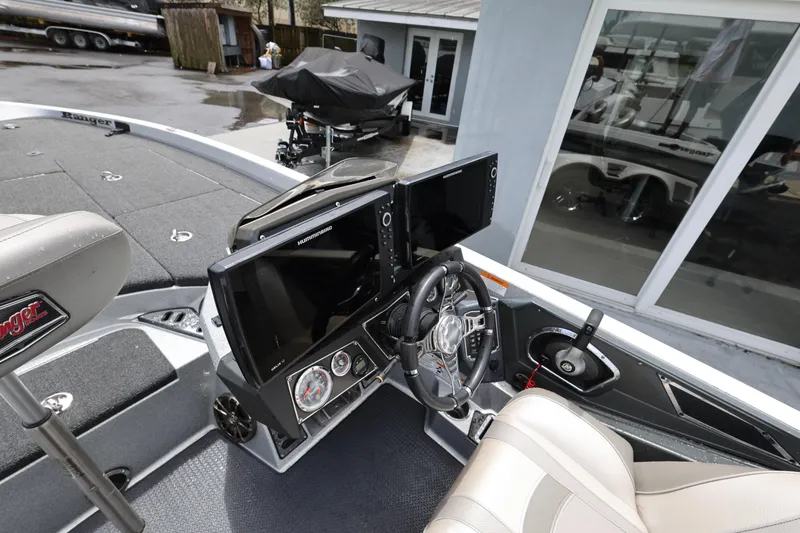 Slide: The Image of 2020 Ranger Z520L boat cockpit with dual monitors and steering wheel. - 11
