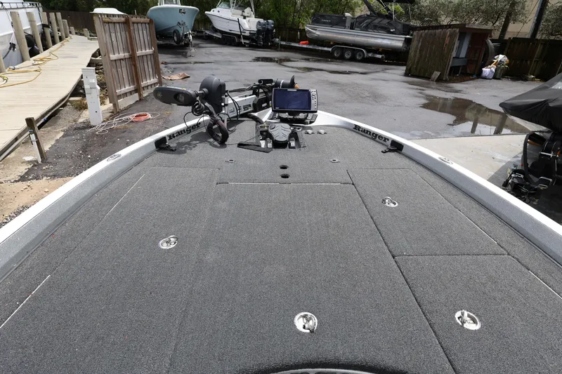 Slide: The Image of 2020 Ranger Z520L boat deck with fishing equipment and control panel. - 12