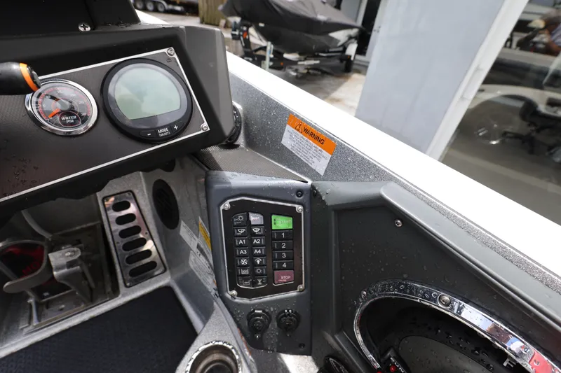 Slide: The Image of Dashboard of a 2020 Ranger Z520L boat with control panel and gauges. - 14