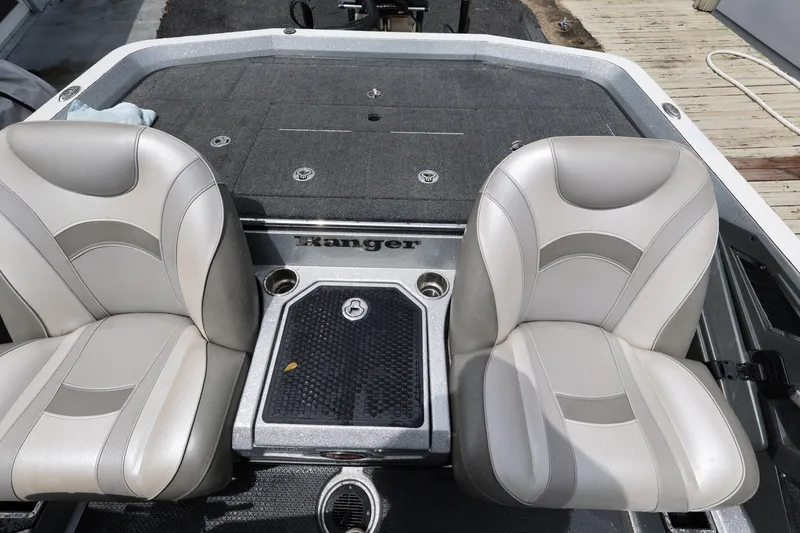 Slide: The Image of 2020 Ranger Z520L boat interior with dual seats and storage compartment. - 20