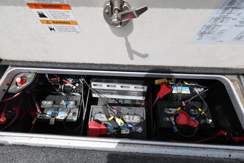 Slide: The Image of Battery compartment of a 2020 Ranger Z520L boat with multiple batteries and wiring. - 23