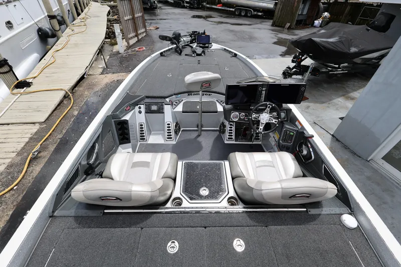 Slide: The Image of 2020 Ranger Z520L boat interior with dual seats and advanced navigation equipment. - 9