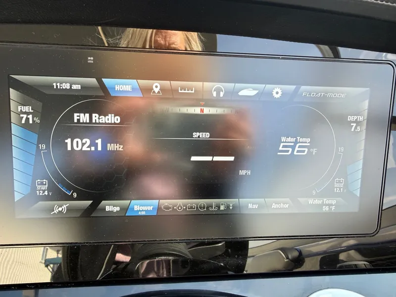 Slide: The Image of Yamaha 242 Limited S 2018 boat display showing FM radio and water temperature. - 12