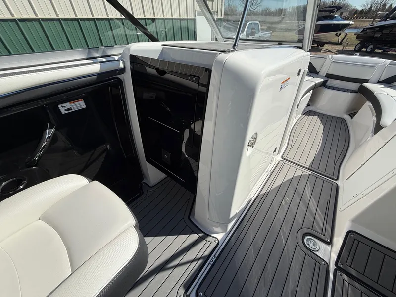 Slide: The Image of Interior of a 2018 Yamaha Boats 242 Limited S with gray flooring. - 16
