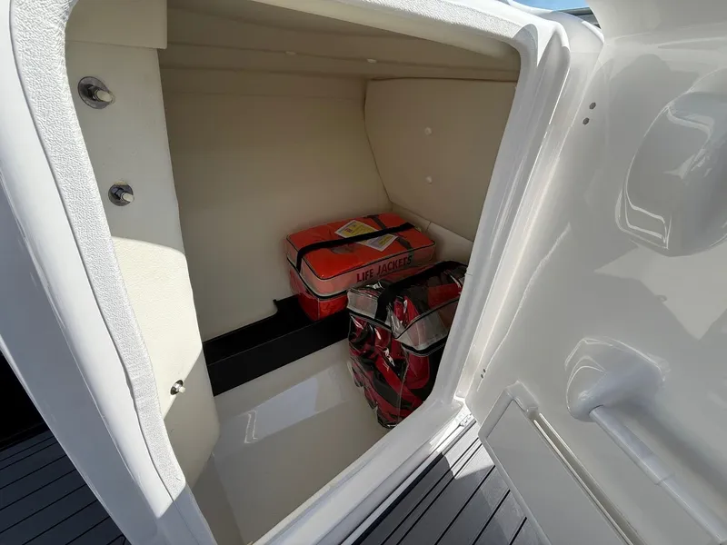 Slide: The Image of Storage compartment in Yamaha 242 Limited S boat with life jackets, 2018 model. - 17