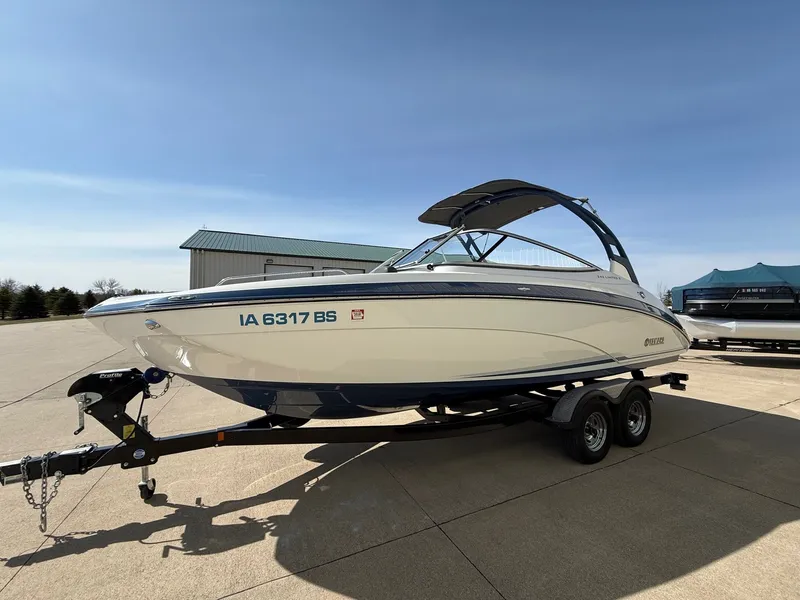 Slide: The Image of 2018 Yamaha Boats 242 Limited S on trailer outdoors. - 2