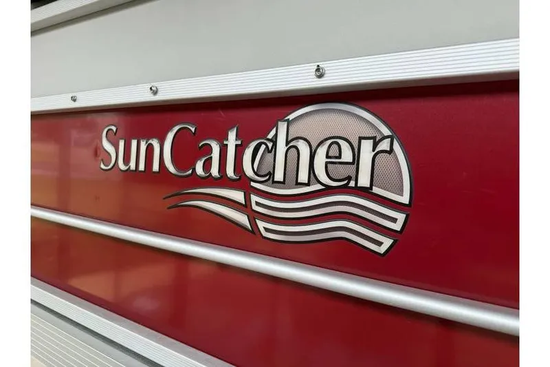 Slide: The Image of SunCatcher logo on red G3 Angler V145 boat, 2016 model. - 2