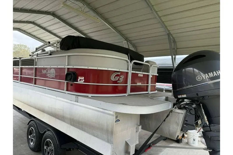 Slide: The Image of 2016 G3 Angler V145 boat with Yamaha motor under a metal shelter. - 4