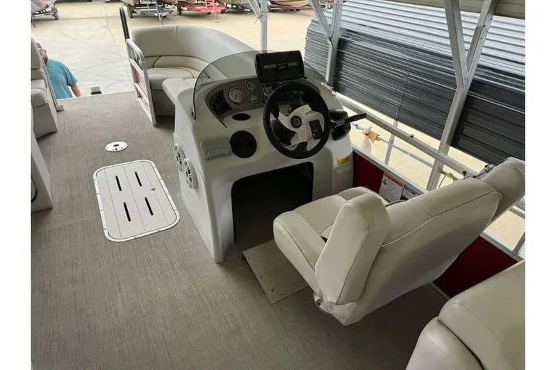 Slide: The Image of 2016 G3 Angler V145 boat interior with steering console and seating. - 5