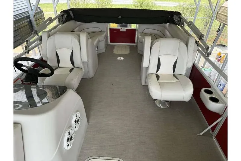 Slide: The Image of Interior of 2016 G3 Angler V145 boat with white seating and steering console. - 7