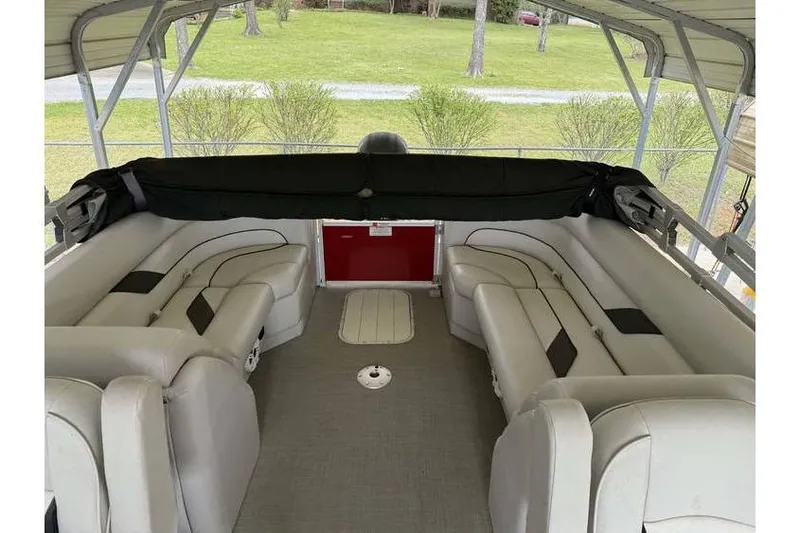 Slide: The Image of Interior of 2016 G3 Angler V145 boat with cushioned seating under a canopy. - 8