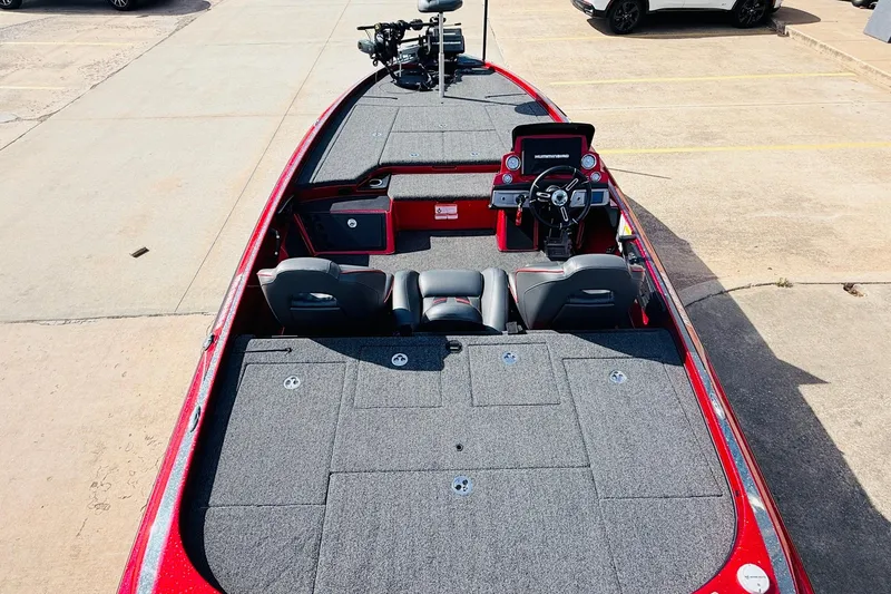 Slide: The Image of 2020 Nitro Z21 Pro boat with spacious deck and modern controls in a parking lot. - 11