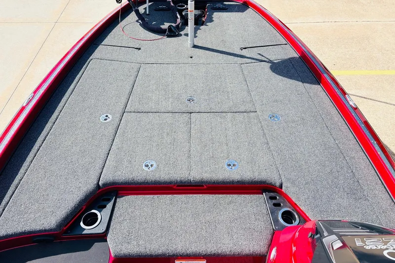 Slide: The Image of 2020 Nitro Z21 Pro boat deck with gray carpeting and red trim. - 19
