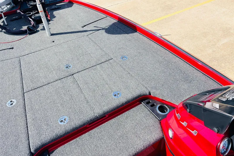 Slide: The Image of 2020 Nitro Z21 Pro boat deck with gray carpet and red trim. - 21
