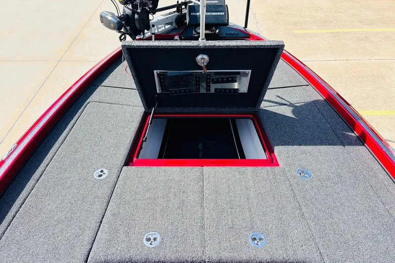 Slide: The Image of 2020 Nitro Z21 Pro boat deck with open storage compartment and fishing equipment. - 24