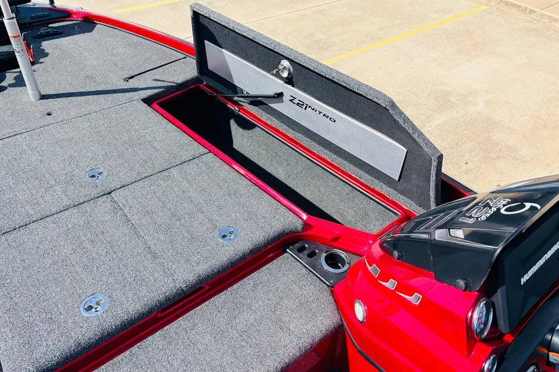 Slide: The Image of 2020 Nitro Z21 Pro boat with open storage compartment and carpeted deck. - 25