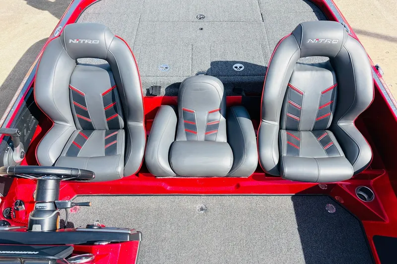 Slide: The Image of 2020 Nitro Z21 Pro boat seats, gray with red accents, steering wheel visible. - 36