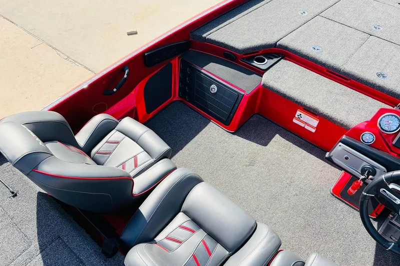 Slide: The Image of 2020 Nitro Z21 Pro boat interior with gray seats and red accents. - 37