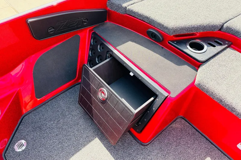 Slide: The Image of 2020 Nitro Z21 Pro boat interior with open storage compartment and red accents. - 39