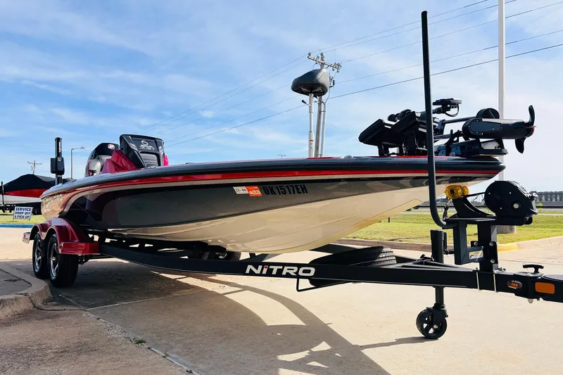 Slide: The Image of 2020 Nitro Z21 Pro boat on trailer, parked outdoors under clear sky. - 4