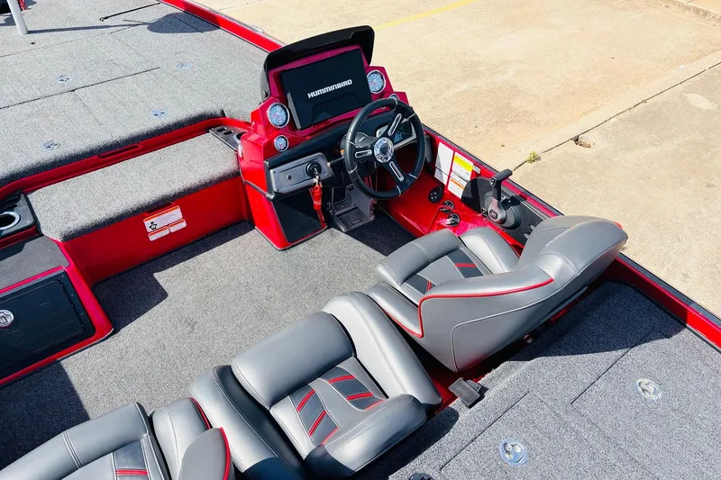 Slide: The Image of 2020 Nitro Z21 Pro boat interior with red and gray seating and steering console. - 41