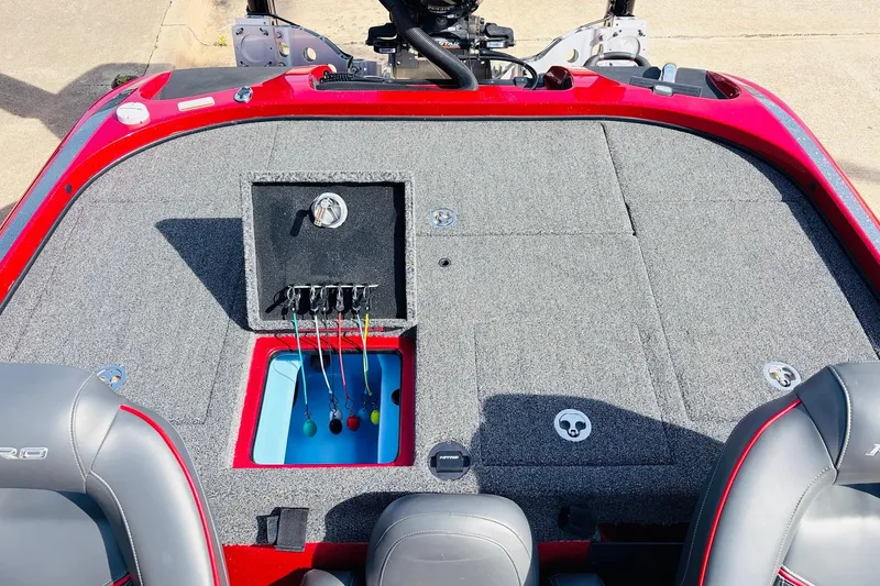 Slide: The Image of 2020 Nitro Z21 Pro boat interior with storage compartments and fishing rod holders. - 47