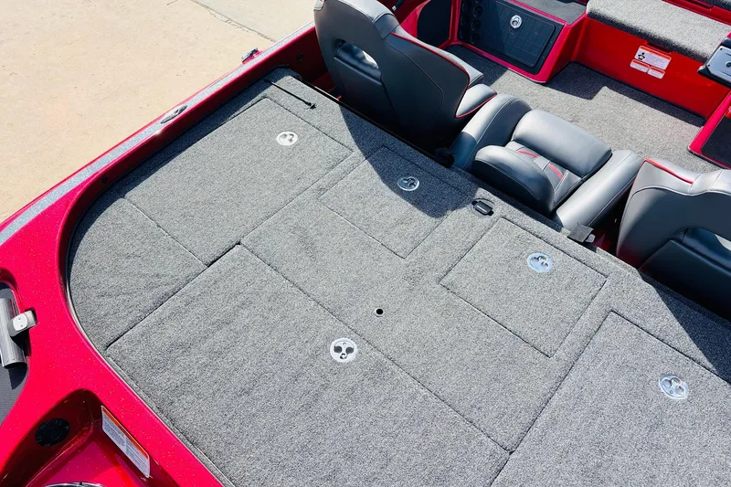 Slide: The Image of 2020 Nitro Z21 Pro boat interior with gray carpet and black seats. - 52