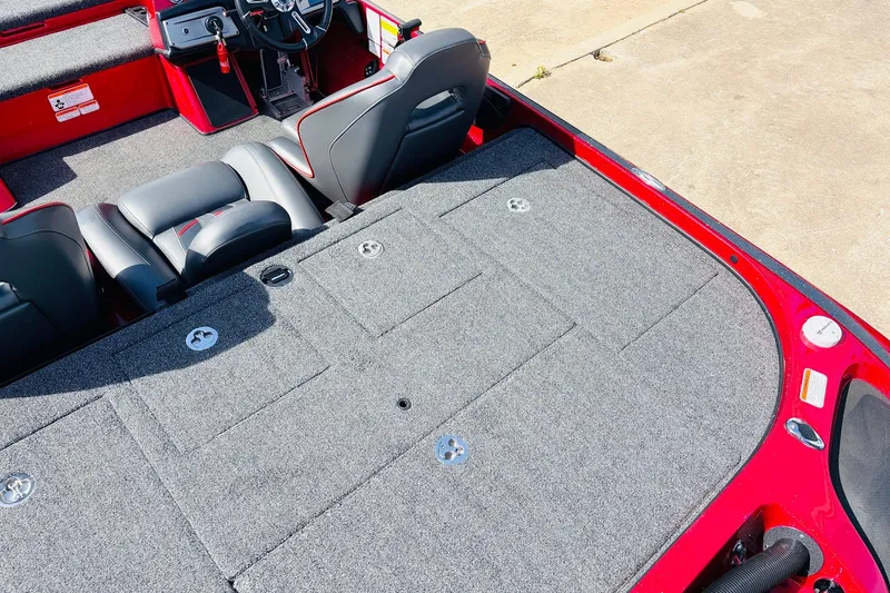 Slide: The Image of 2020 Nitro Z21 Pro boat interior with gray carpet and black seats. - 56