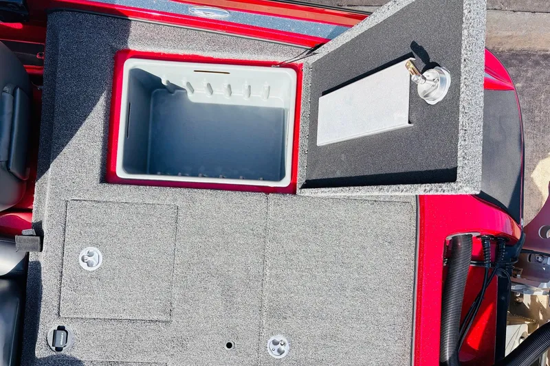 Slide: The Image of 2020 Nitro Z21 Pro boat storage compartment with open lid and gray interior. - 58