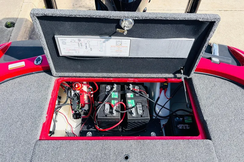 Slide: The Image of Open battery compartment of 2020 Nitro Z21 Pro boat, showing wiring and components. - 61