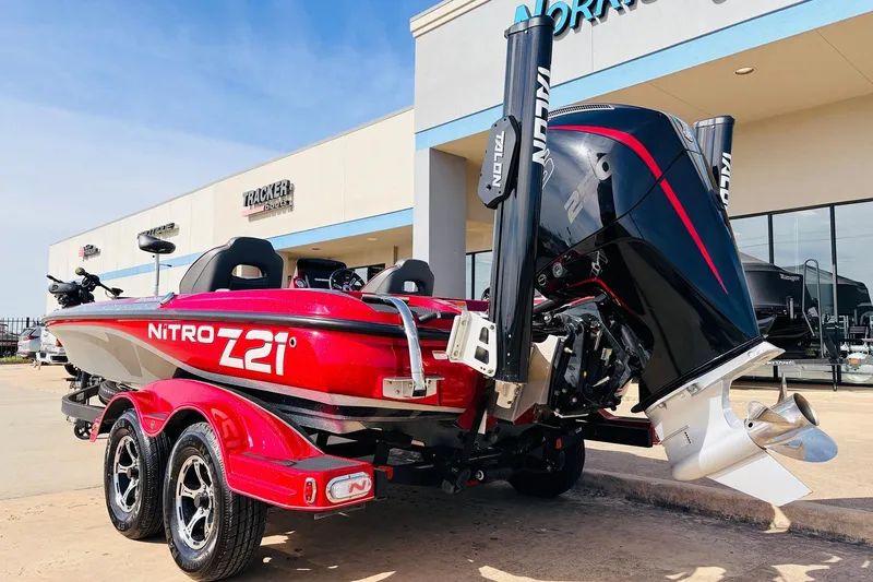 Slide: The Image of 2020 Nitro Z21 Pro boat with dual axle trailer, displayed outside a dealership. - 8