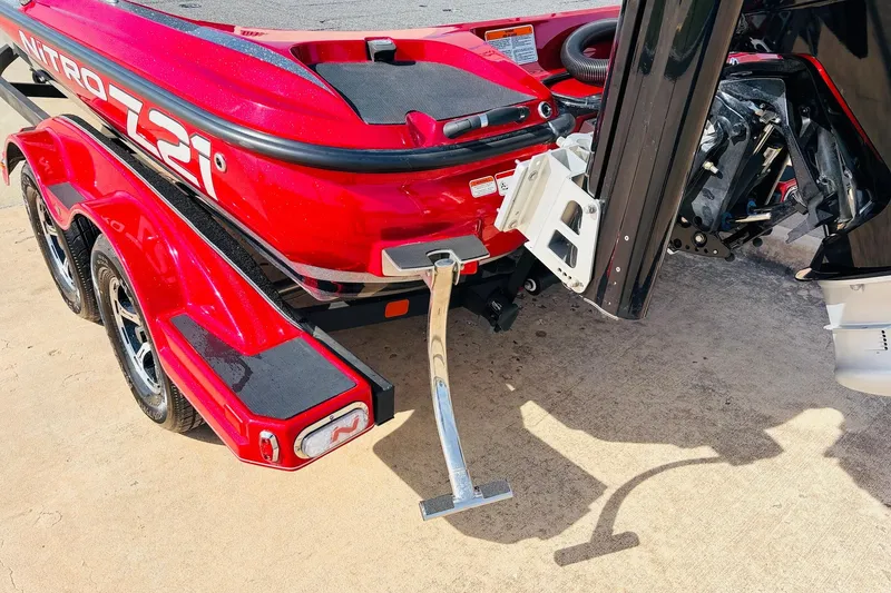 Slide: The Image of Red 2020 Nitro Z21 Pro boat on trailer, showcasing rear and motor details. - 9