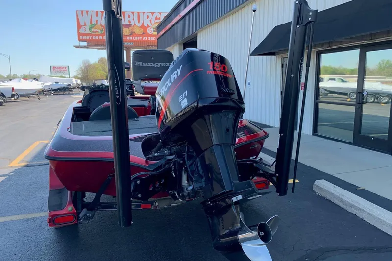 Slide: The Image of 2001 Ranger R83 boat with Mercury 150 EFI engine in parking lot. - 3