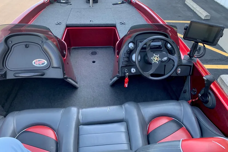 Slide: The Image of Interior of a 2001 Ranger R83 boat with steering wheel and navigation system. - 4