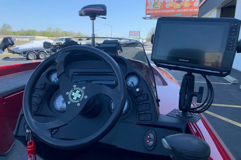 Slide: The Image of 2001 Ranger R83 boat dashboard with steering wheel and Garmin GPS system. - 5