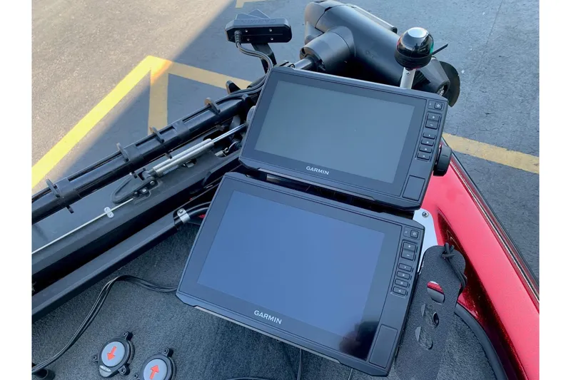 Slide: The Image of Dual Garmin displays on a 2001 Ranger R83 boat dashboard. - 8