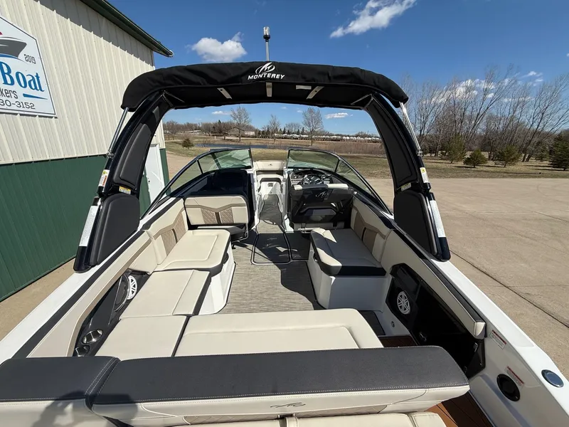 Slide: The Image of Interior of a 2022 Monterey 278SS Super Sport boat under sunny skies. - 10