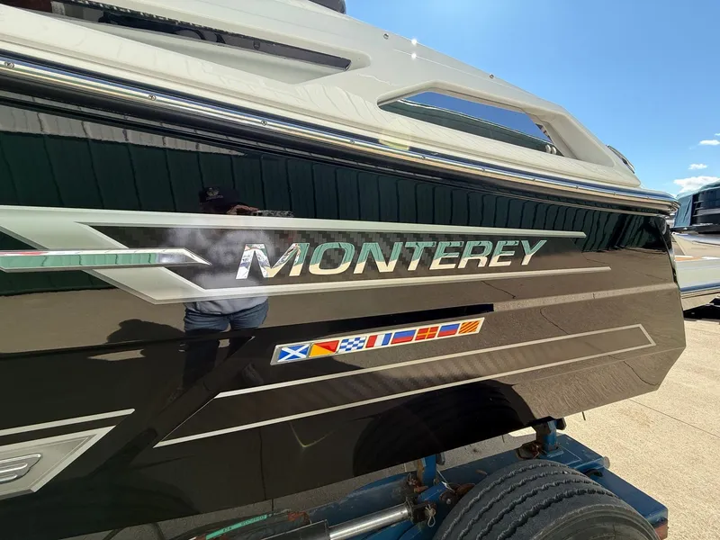 Slide: The Image of 2022 Monterey 278SS Super Sport boat with flag decals. - 3