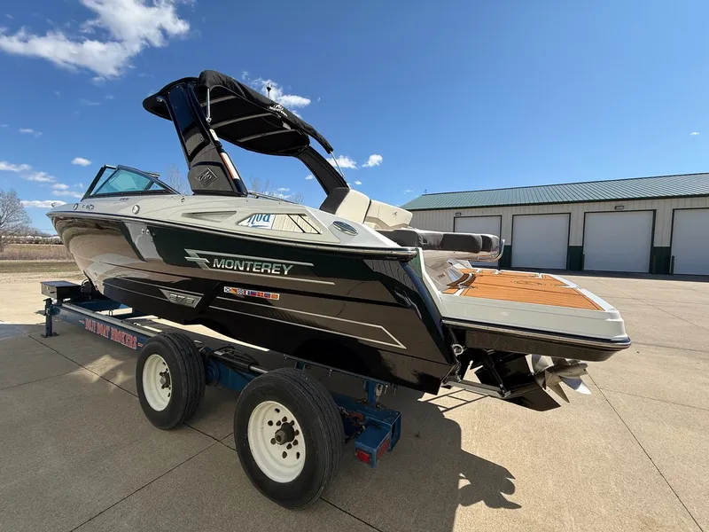 Slide: The Image of 2022 Monterey 278SS Super Sport boat on trailer, sunny day. - 5