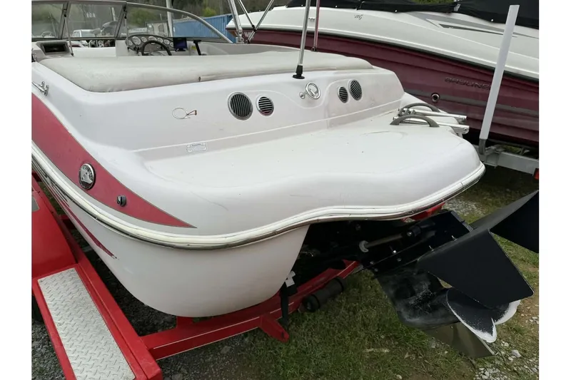Slide: The Image of 2005 Tahoe Q4 Sport boat on trailer, rear view with propeller visible. - 3