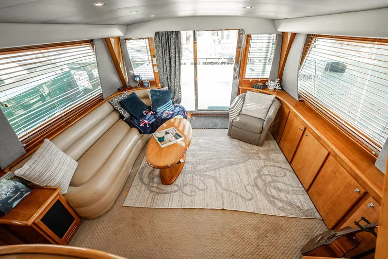 Slide: The Image of Luxurious interior of 2004 Navigator 5700 Rival Pilothouse yacht with elegant seating and decor. - 15