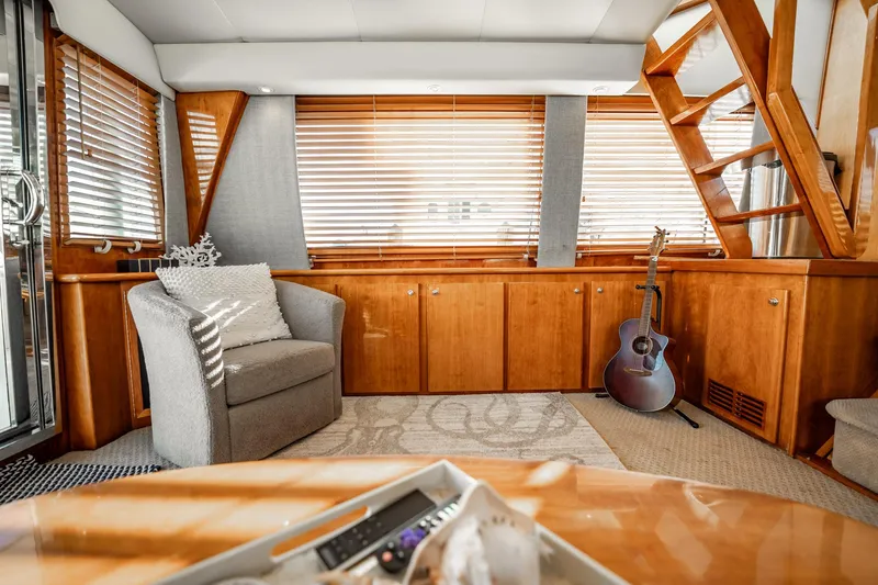 Slide: The Image of Luxurious 2004 Navigator 5700 yacht interior with cozy seating and guitar. - 18