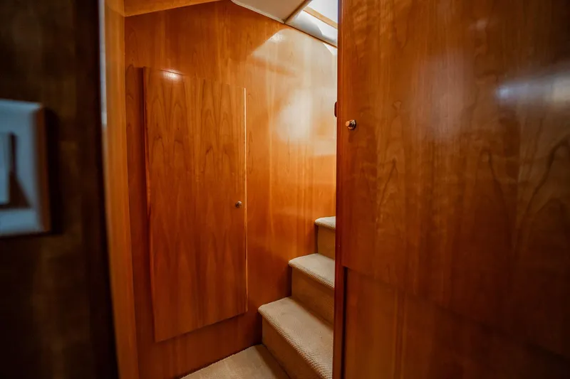 Slide: The Image of Interior staircase of 2004 Navigator 5700 Rival Pilothouse with wooden paneling. - 37