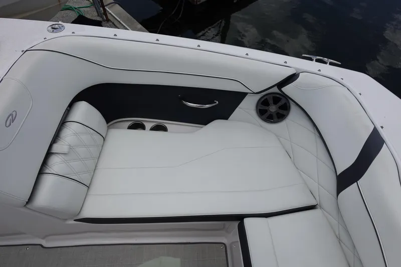 Slide: The Image of Luxurious seating area on a 2021 Regal 23 OBX boat with white upholstery. - 21
