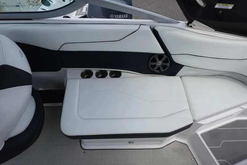 Slide: The Image of 2021 Regal 23 OBX boat interior with white seating and cup holders. - 40