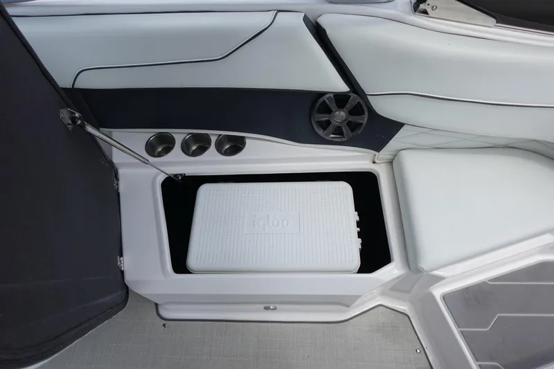 Slide: The Image of 2021 Regal 23 OBX boat interior with built-in cooler storage compartment. - 41