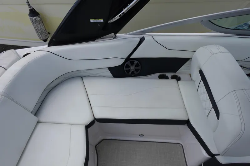 Slide: The Image of 2021 Regal 23 OBX boat interior with white seating and speaker detail. - 44