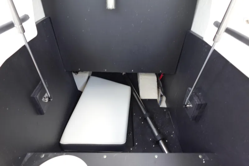 Slide: The Image of Interior view of a 2021 Regal 23 OBX boat storage compartment. - 45